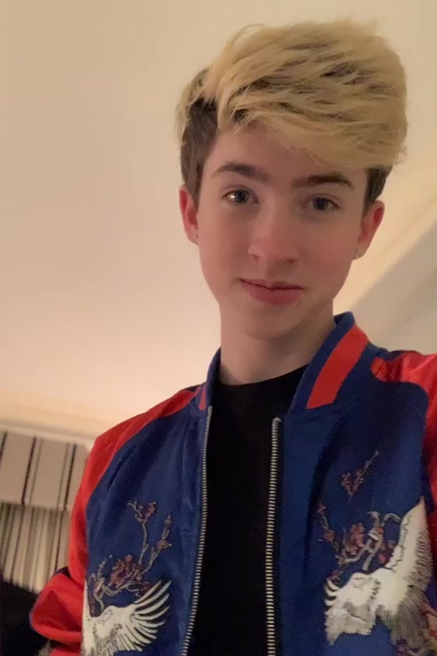 Cash Baker in black shirt and blue jacket