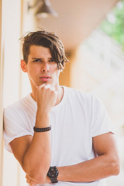 Glimher Croes is wearing white t shirt and giving a flirty look to camera.