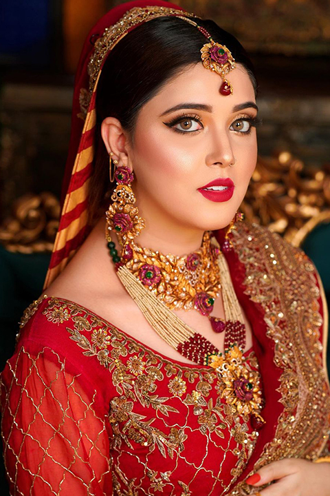 Famous Pakistani Tiktok Star, Model, Snack Video Model and Youtube Content Creator in red bridal dress