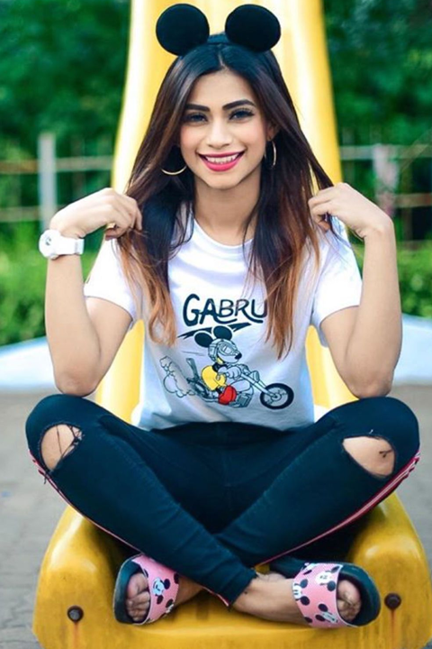 Nagma Mirajkar posing as mouse with mouse ears and wearing white tshirt and blue stylish jeans