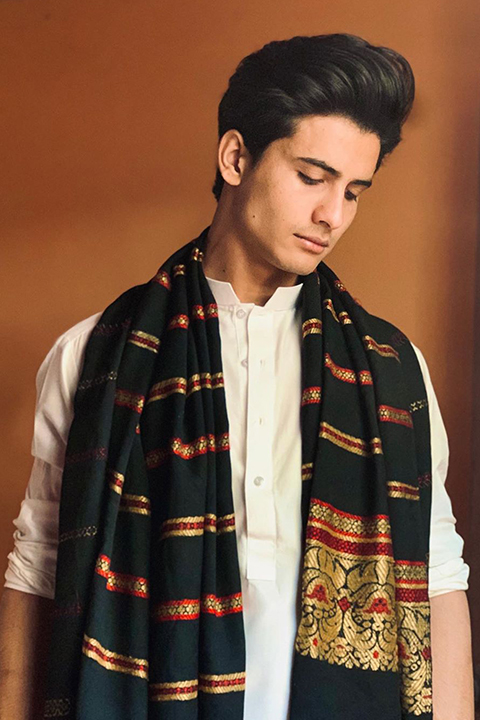 Pir Ahmed in white kurta and black printed shawal