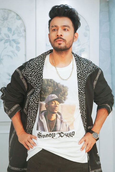 Tony Kakkar in white tshirt with fancy jacket