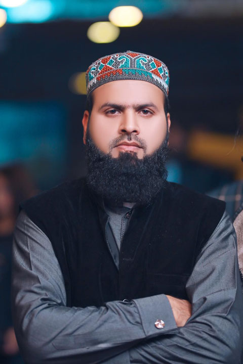 Malik Usman wearing grey kurta and black waistcoat