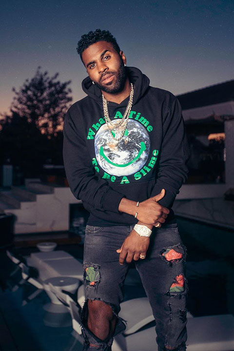 Jason Derulo wearing black hood and dark grey jeans