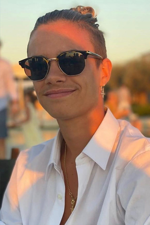 Romeo Beckham smiling and white dress
