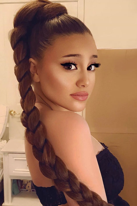 Paige Niemann Doppelganger of Ariana Grande in black dress and pony tail