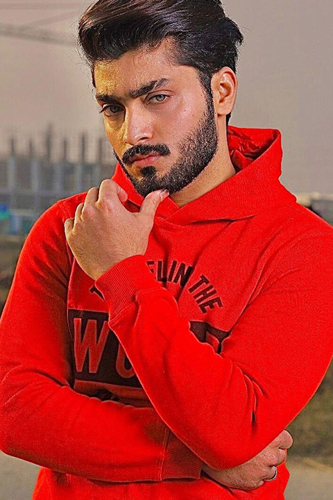 Arib Abbas posing red hoodie