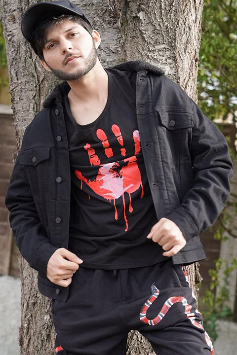 Nadeem Mubarik in black shirt and jacket