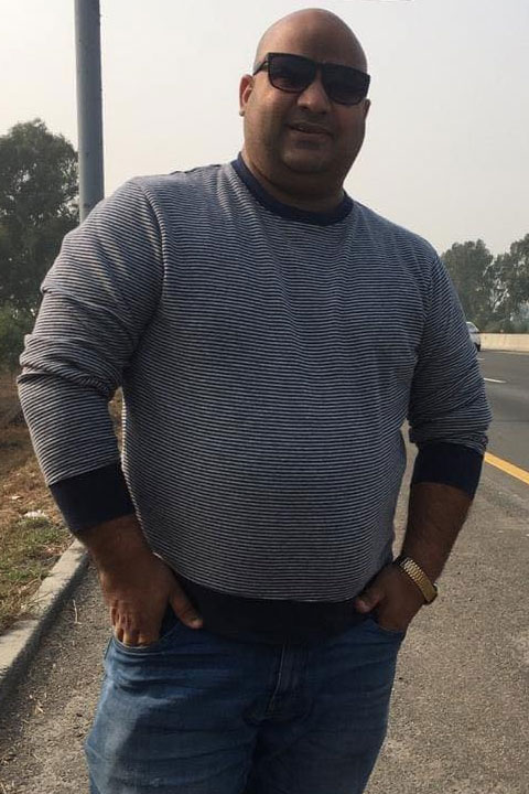 Bhola Record in grey shirt and Blue jeans
