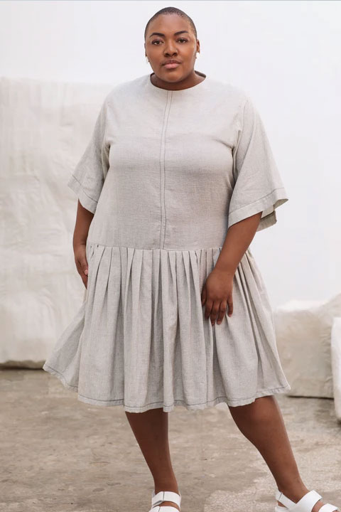 Nyome Nicholas-Williams in cream color frock