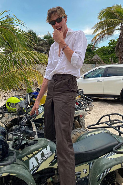 Lucky Blue Smith is looking beautiful in white shirt and brown pent.
