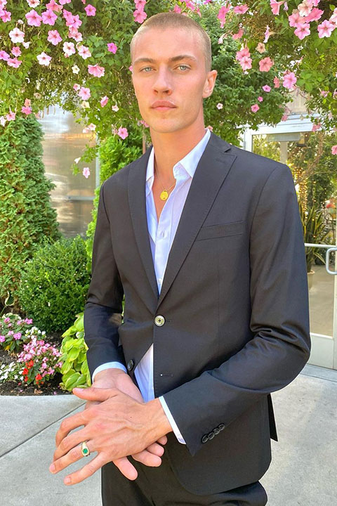 Lucky Blue Smith is looking beautiful in pent coat and posing for a picture.