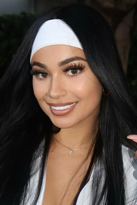Tiffy Monroex Is beautifully smiling for a picture.